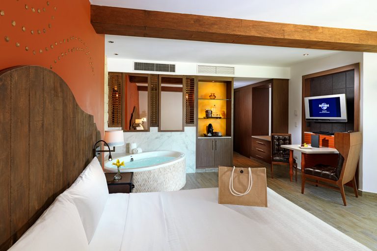 King bed room with jacuzzi in the background.