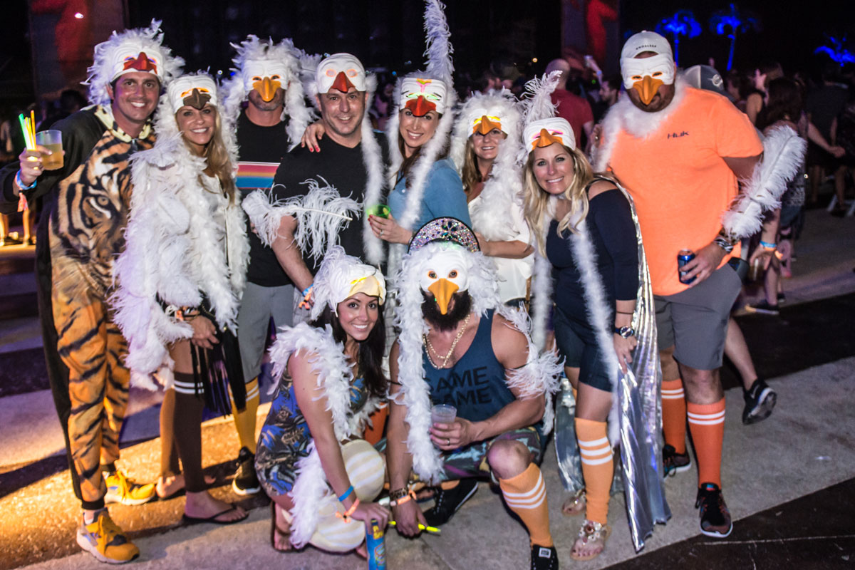 A group photo of guests in theme night costumes.