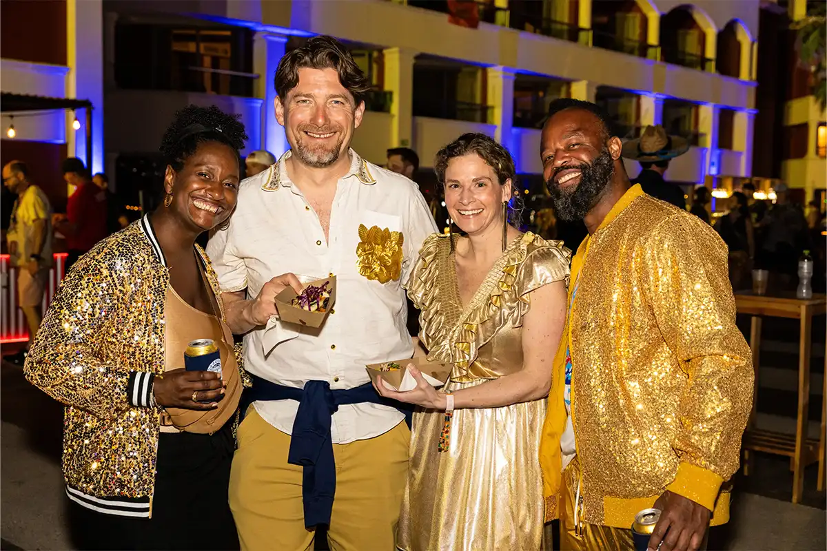 A group photo of guests in theme night costumes.