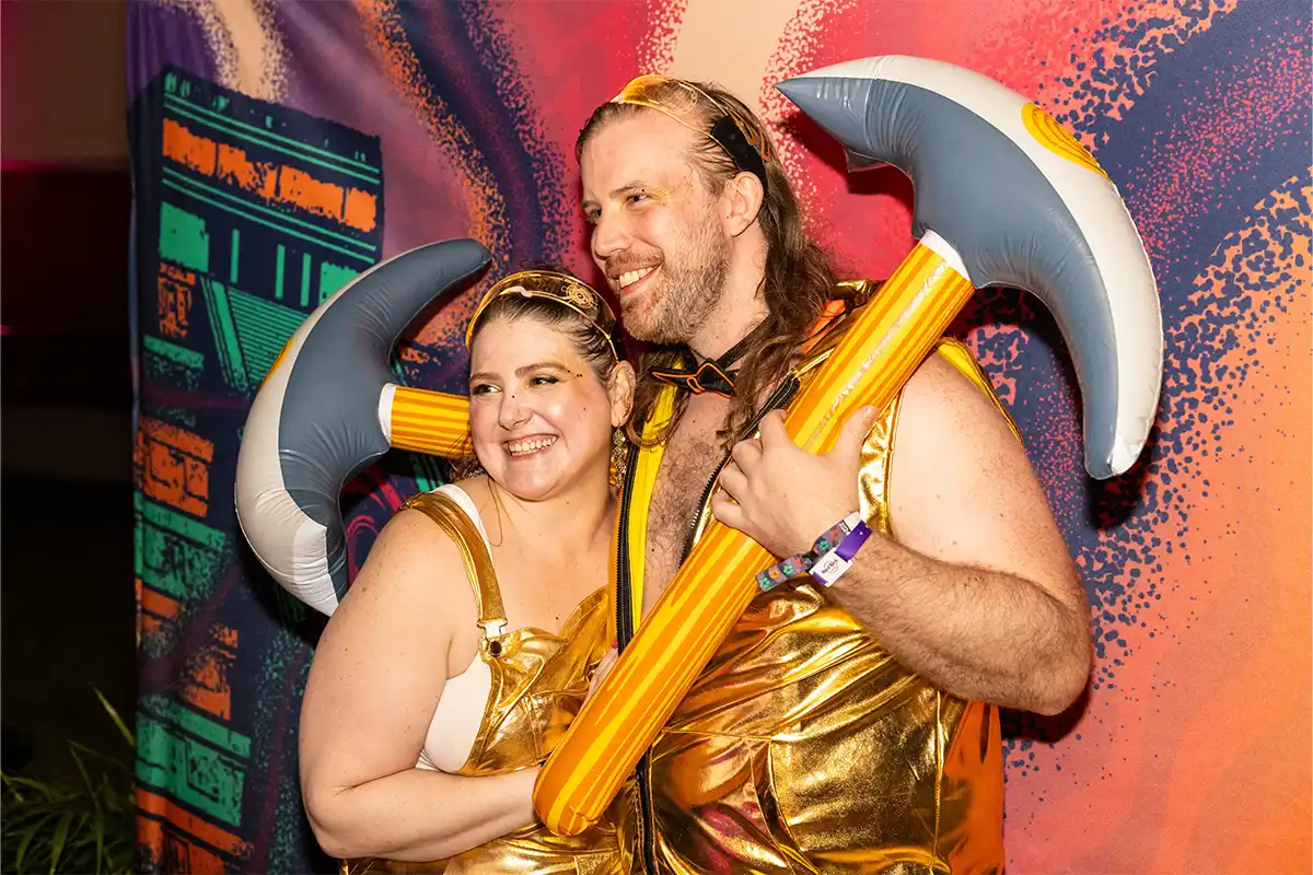Guests posing for a photo at the One Big Holiday photobooth.