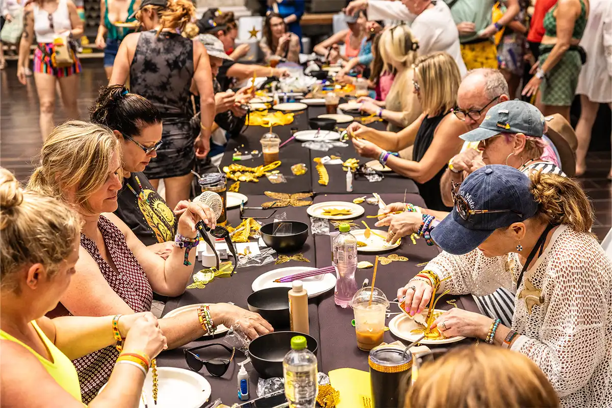 Guests participating in a theme night crafting activity.
