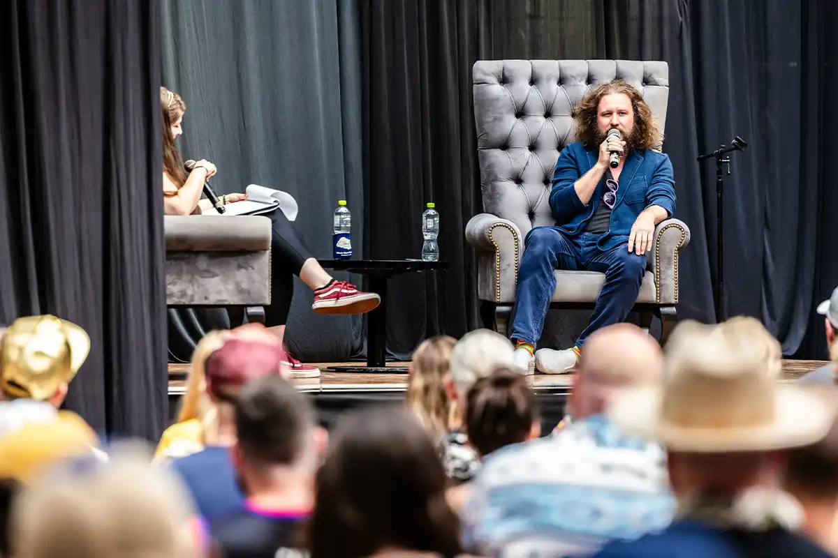 Jim James participating in a Q and A activity.