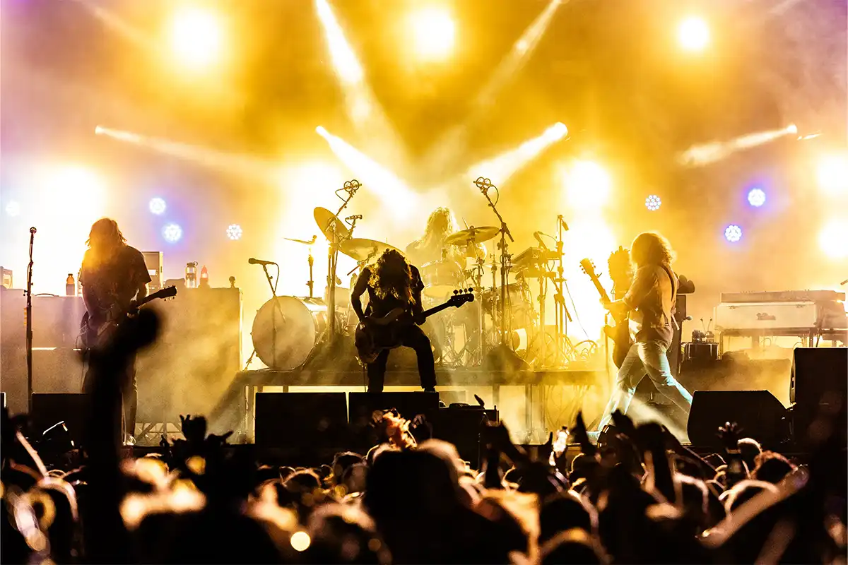 A close up photo of My Morning Jacket performing on the Concert Courtyard Main Stage.