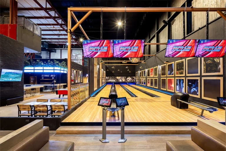 A bowling alley with bar set up next to it.